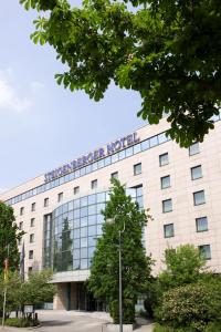 a building with a sign on the front of it at Steigenberger Dortmund in Dortmund