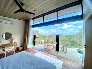 Postel nebo postele na pokoji v ubytování COVE VILLAS Mandalika