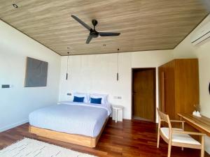 Postel nebo postele na pokoji v ubytování COVE VILLAS Mandalika