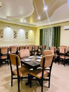 a conference room with a table and chairs at Hotel Mayur in Alwar