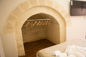Postel nebo postele na pokoji v ubytování La Corte Dei Cavalieri