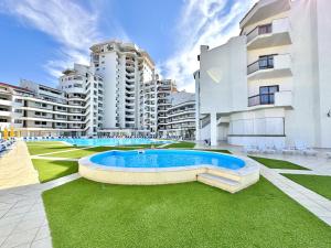 a swimming pool in the middle of a building at Albufeira Skylight 2 by Homing in Vale de Pedras