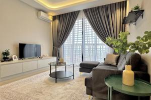 a living room with a couch and a tv at KLIA Residensi With Netflix in Nilai