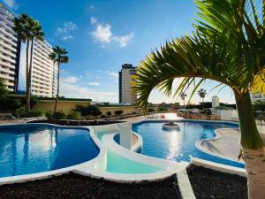 The swimming pool at or close to Sunset Paradise