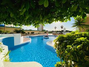 The swimming pool at or close to Sunset Paradise