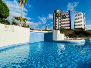 The swimming pool at or close to Sunset Paradise