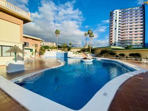 The swimming pool at or close to Sunset Paradise