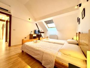 Ένα ή περισσότερα κρεβάτια σε δωμάτιο στο Le Dome-Nobile