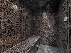 a bathroom with a shower and a tiled wall at Tignes - Duplex rénové, 3 pièces, proche pistes, parking inclus - FR-1-641-115 in Tignes