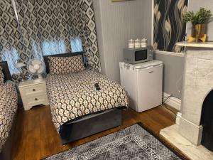 Kuchyň nebo kuchyňský kout v ubytování OYO Woodville Lodge Leeds