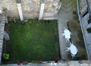 an aerial view of a yard with two white chairs at Casa Toronzue in Frajén +9 photos