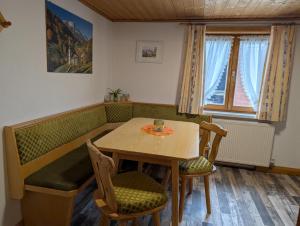 a dining room with a table and chairs at Montafonerhaus in Schruns
