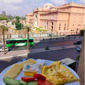 a plate of food on a table with a bus at Museum Plaza in Cairo