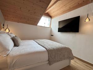 Postel nebo postele na pokoji v ubytování Snowflake Apartment