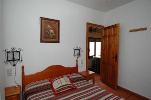 Postel nebo postele na pokoji v ubytování Apartamentos Turísticos Rural Los Tinaos