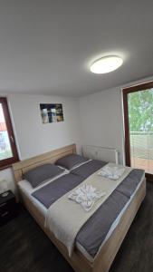 Postel nebo postele na pokoji v ubytování Tatras Apartment City Center