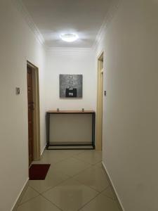 a room with a large screen in the middle of it at Hillview Homes Apartment in Ndola