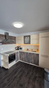 Kuchyň nebo kuchyňský kout v ubytování Tatras Apartment City Center