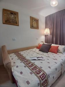 a bedroom with a large bed with a blanket on it at 2-к Люкс Студія з Окремою Спальнею, Центр, Великий Балкон, Низький Поверх in Mykolaiv
