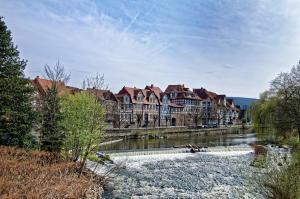 a large building on the side of a river at Weserstein in Hannoversch Münden +10 photos