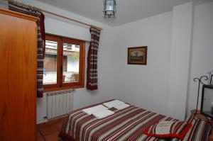 Postel nebo postele na pokoji v ubytování Apartamentos Turísticos Rural Los Tinaos