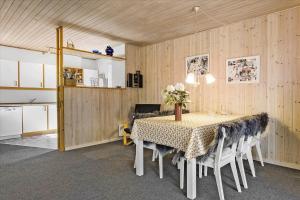 a kitchen and dining room with a table and chairs at 406-Vestervig-Bekkasinvej-6 in Vestervig +14 photos