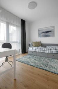 En eller flere senge i et værelse på Perfect Moments Apartments, Šventoji