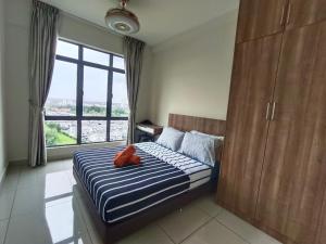a bedroom with a bed with a red stuffed animal on it at ARC Austin hill 2BEDROOM 2BATHROOM HOST by Wendy in Johor Bahru +132 photos