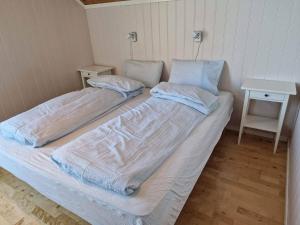 Una cama o camas en una habitación de Tobiasbua 2 fotos más