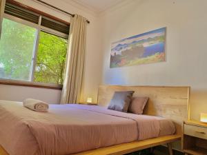 Krevet ili kreveti u jedinici u okviru objekta WanderHome 3BDR House