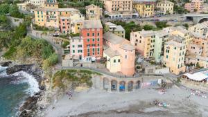 an aerial view of a town with a beach at Newly Renovated Ocean View Flat in Sori