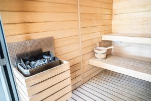 a sauna with wood paneling and a wooden wall at La Perle de Domme in Sarlat-la-Canéda