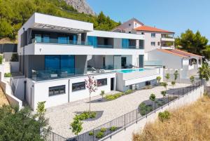 an aerial view of a house with a swimming pool at NEW! Villa Angelus – Your Luxurious Retreat near the Sea in Omiš