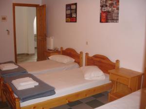 Ein Bett oder Betten in einem Zimmer der Unterkunft Siroco's Rooms And Studios