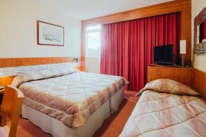 Letto o letti in una camera di Hôtel & Résidence Octel