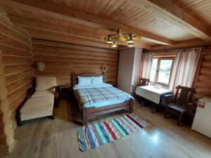 Postel nebo postele na pokoji v ubytování Knyazhyj Dvir