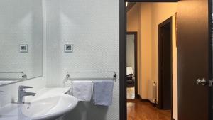 a bathroom with a sink and a mirror at Etxetxobarri, caserío independiente con vistas a la crestería de Anboto in Eguia +27 photos