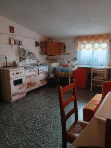 a kitchen with a sink and a stove top oven at Vacanze Serene in Montecilfone +15 photos