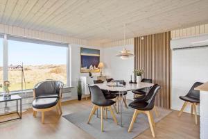 a dining room with a table and chairs at 132-Thisted-Sotungevej-31 in Thisted