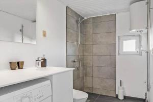 a white bathroom with a shower and a toilet at 132-Thisted-Sotungevej-31 in Thisted +18 photos