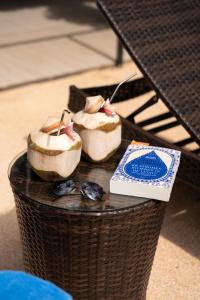 a table with food on top of a basket at Coconut Bay Eco Resort in Srithanu