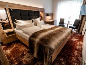Postel nebo postele na pokoji v ubytování Wellness & Ayurveda Hotel Am Eichenberg + 37 fotografií