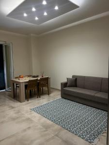 a living room with a couch and a table at San Pietro Pontremoli in Pontremoli +29 photos