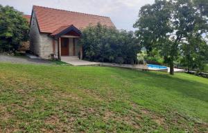 a house with a yard and a swimming pool at Holiday House Visoko by Villas Guide in Brežnica