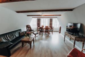 a living room with a couch and a table at Apartment Klara in Lübeck