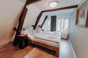 a bedroom with a bed and a large window at Apartment Klara in Lübeck