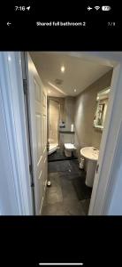 a bathroom with a sink and a toilet and a tub at Luxury Room - St Leonards on Sea - East Sussex in Hollington
