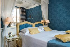 Postel nebo postele na pokoji v ubytování Art Hotel Orologio