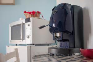 Kuchyň nebo kuchyňský kout v ubytování Le Piane