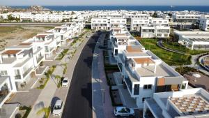 an aerial view of a street with white buildings at Four Seasons Life by Sea Homes in Aglantzia +4 photos
